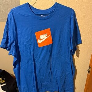 Nike Men's Tee in Vibrant Blue with Orange Logo